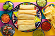 Tamale with corn leaf and sauces guacamole