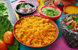 Mexican yellow rice with chilis and sauces