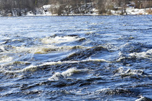 River In Russia In The Winter Landscape. Forest River With A Strong Current In The Leningrad Region.