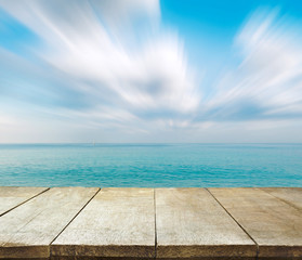 Wall Mural - image of wooden table in front of summer sea in thailand