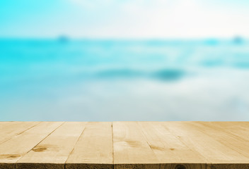 Wall Mural - image of wooden table in front of summer sea in thailand