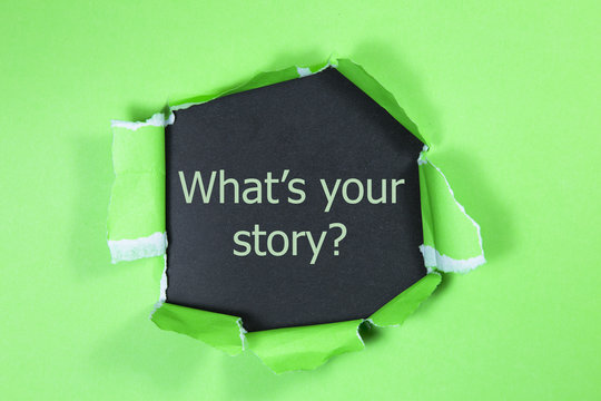 The motivational quote what is your story appearing behind torn paper.