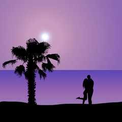 Loving couple on the seashore at night