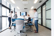 © .shock - business people group entering meeting room, motion blur