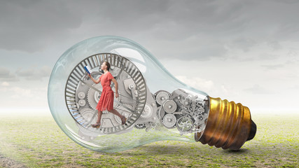 Wall Mural - woman in electric bulb