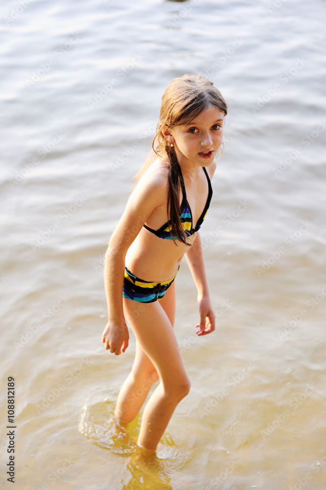Cute little girl at beach Stock Photo Adobe Stock