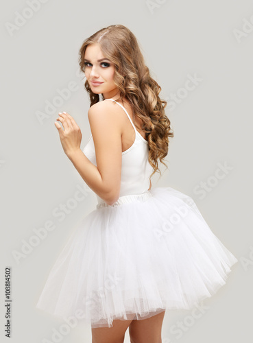 Fotografie, Obraz Beautiful blonde girl wearing white tutu skirt