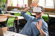 © zinkevych - Positive man using virtual reality device