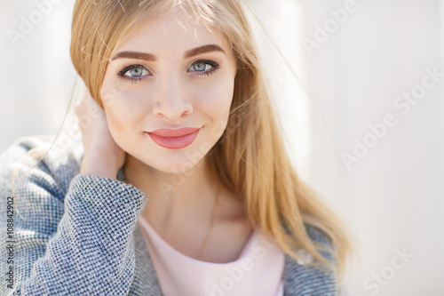 Beautiful Woman With Long Blonde Straight Hair And Grey Eyes Light