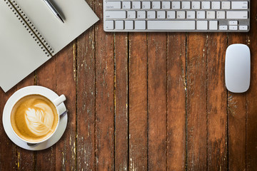 notepad, computer and coffee cup. View from above with copy spac