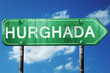 hurghada road sign, vintage green with clouds background