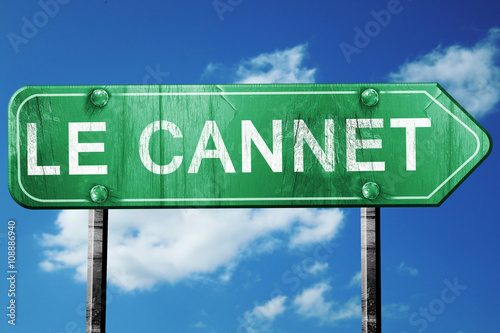 Fotomural le cannet road sign, vintage green with clouds background