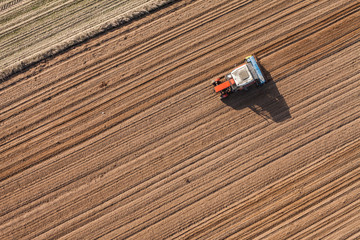 aerial view of the tractor on the harvest field