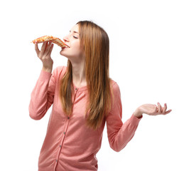 Wall Mural - Happy young woman eating slice of hot pizza, isolated on white