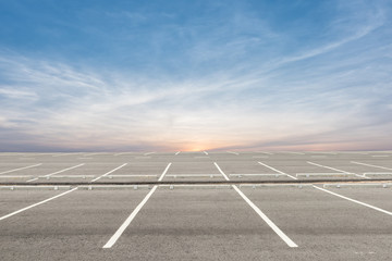 empty parking lot on sunset background