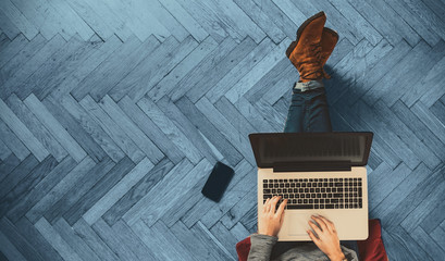 Modern workspace - girl with laptop working.