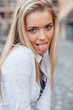 © jakubzak - Portrait of a happy young girl. She is showing her tongue