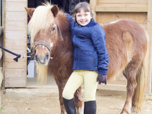 Portrait Of Smiling Girl With Pony