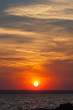 © anatoliil - Dramatic sunset over the sea. the setting sun on a background of