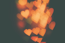 Many Orange Hearts On A Dark Background. Design Wallpaper.