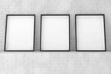 Poster - Blank Picture Frames on the Brick Wall. 3d Rendering