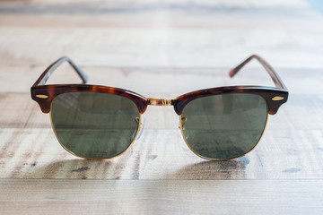 sunglasses on the wood table