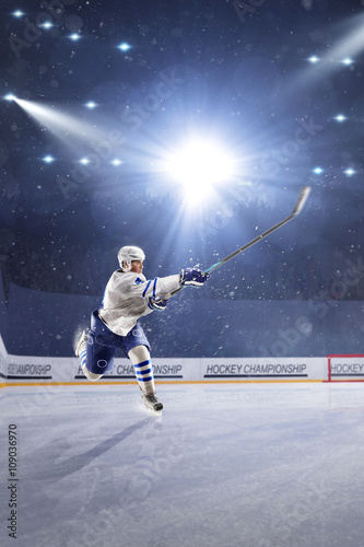 Hockey players shoots the puck and attacks