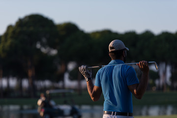 golfer from back at course looking to hole in distance