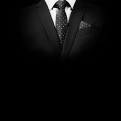 man in suit on a black background