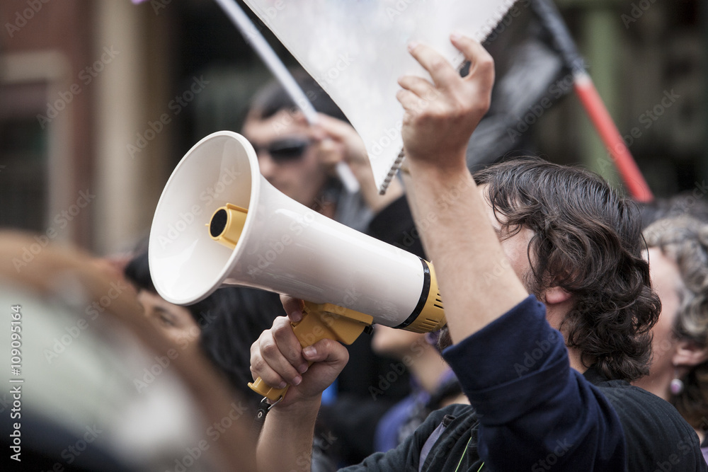 demostrator with megaphone and notebook protesting - obrazy, fototapety, plakaty 