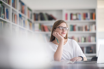 Poster - female student study in school library