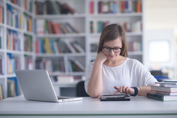 Wall Mural - female student study in school library