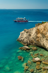 Wall Mural - Porto Katsiki, Lefkada, Greece. Tourist boat and people bathing