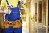 Fototapeta Na drzwi - construction worker on new house building process with copy spac