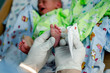 © sushytska - doctor takes a blood test in newborns
