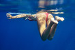 woman buttocks and legs underwater