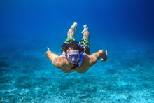 Underwater Shoot Of A Young Man Snorkeling In A Tropical Sea