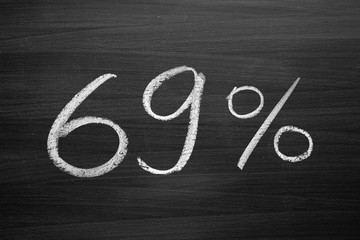 Wall Mural - 69 percent header written with a chalk on the blackboard