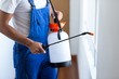 © WavebreakmediaMicro - Midsection of pest control worker with sprayer