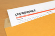 © Noey smiley - life Insurance application form on brown envelope