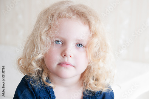 Portrait Of A Pretty Toddler With Blonde Curly Hair Buy This