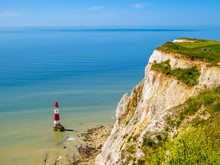 White Chalk Cliffs And Beachy Head Lighthouse, Eastbourne, East Sussex, England