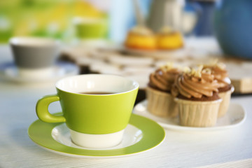 Wall Mural - Table setting with tea and cakes indoors