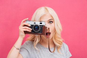 Wall Mural - Charming woman making photo on camera