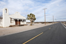 White Building Near Road On Desert