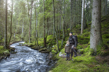 Boy With Father In Forest