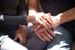 © Connect Images - Senior couple sitting together, touching hands, mid section, close-up