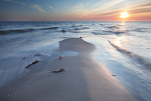 Sandy Beach At Sunset