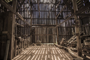 morning light. morning sunlight illuminates the interior of a barn. this is a barn open to the publi