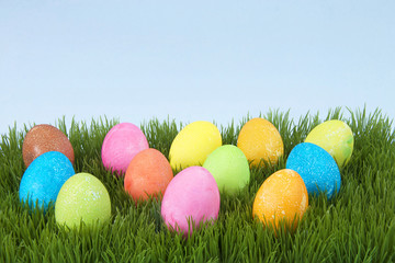 Colorful hand painted decorated easter eggs with speckled texture